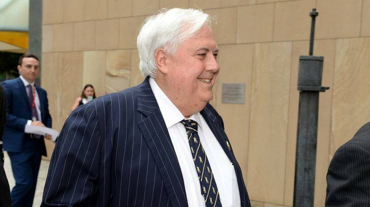 Clive Palmer was all smiles on Thursday morning as he entered court. Photo: Bradley Kanaris