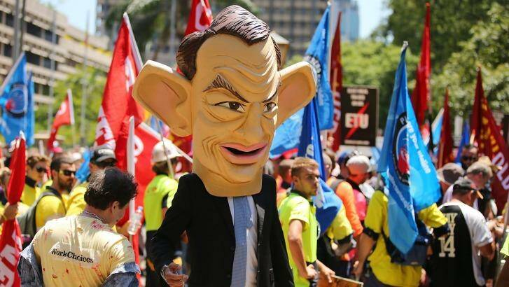 A caricature of Prime Minister Tony Abbott walks among the unionists. Photo: Chris Hyde