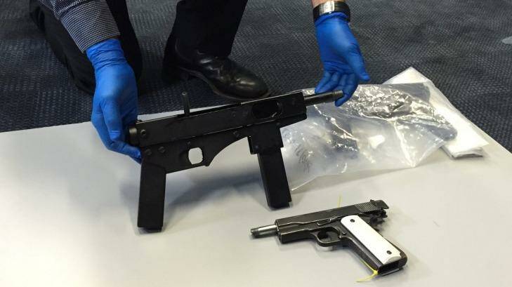 Police found "uzi-style" submachine guns and handguns on the Gold Coast on Friday. Photo: Toby Crockford - Fairfax Media