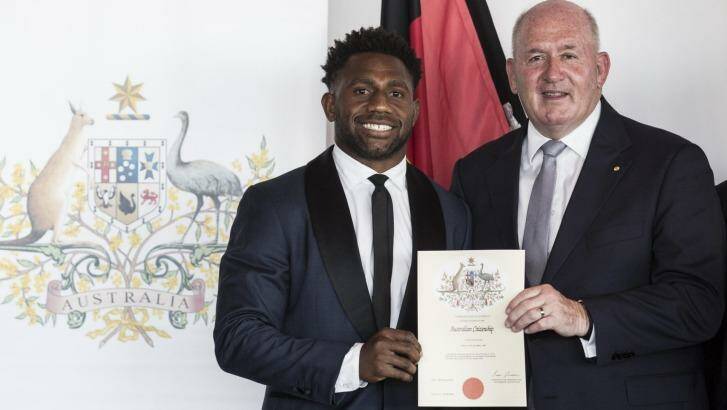 New Aussie: James Segeyaro with Governor General Peter Cosgrove at the Australia Day ceremony on Tuesday. Photo: Dominic Lorrimer