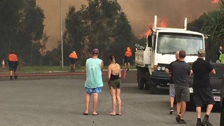 The grassfire spread quickly at Coolum. Photo: Facebook / Scott Bakes