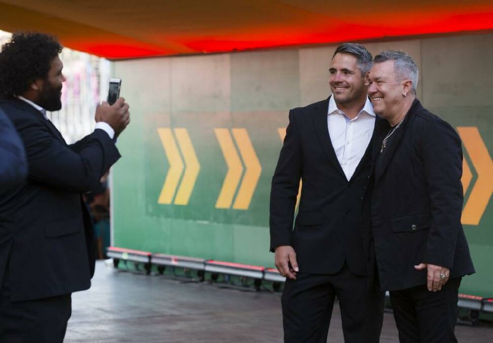 Picture this: Jimmy Barnes with the Broncos’ Corey Parker. Photo: James Brickwood