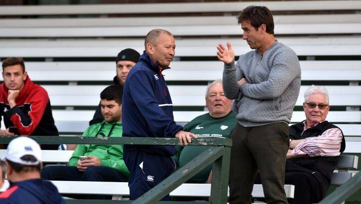 Talking tactics: England coach Eddie Jones chats with Andrew Johns at Randwick Oval during training on Monday.  Photo: Steven Siewert
