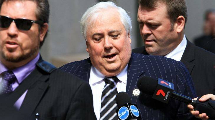 Clive Palmer arrives at the Federal Court on Friday, flanked by private security, for what is expected to be his final day of questioning in this sitting of a public examination into the collapse of Queensland Nickel. Photo: Jorge Branco