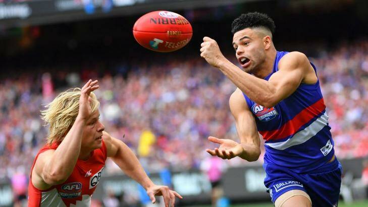 Jason Johannisen on his way to the Norm Smith Medal. Photo: Eddie Jim