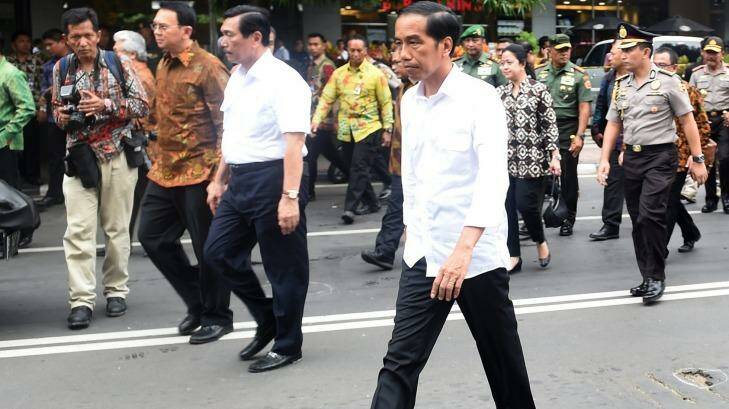 Indonesian President Joko Widodo, centre, visits the site of last week's terror attacks in Central Jakarta,  Photo: Handout/AP