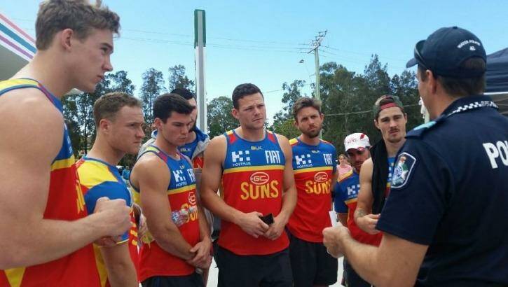 Gold Coast Suns players at a briefing for the search. Photo: Twitter / QPS