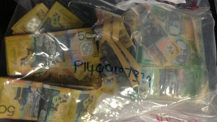 Police seized $1 million in cash during 28 raids across southeast Queensland. Photo: Nine News