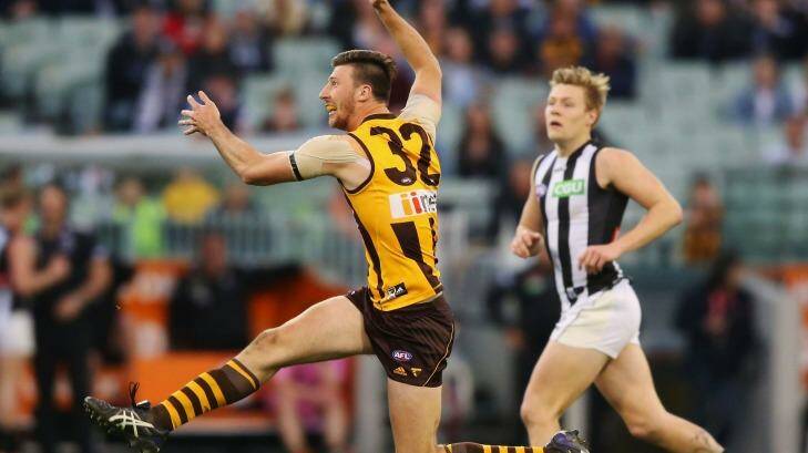 Tense win: Jack Fitzpatrick of the Hawks kicks during Hawthorn's one-point win over Collingwood which delivered the all-Sydney final. Photo: Michael Dodge