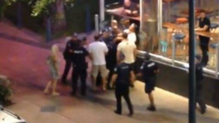 A screenshot of the footage arrest at the Gold Coast, in which Ray Currier appears to be struck several times by police. Photo: Supplied