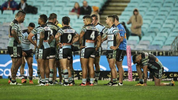 Not over yet ... the Sharks after their loss to the Rabbitohs on Monday night. Photo: Brett Hemmings