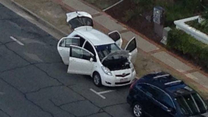 Police officers searched a white Toyota Yaris on Trickett Street for explosives. Photo: Kendall Gilding/Seven News