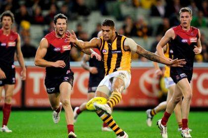 Much has changed since Melbourne's last Friday night game, as shown by the colours worn by Lance Franklin and James Frawley respectively. Photo: Sebastian Costanzo