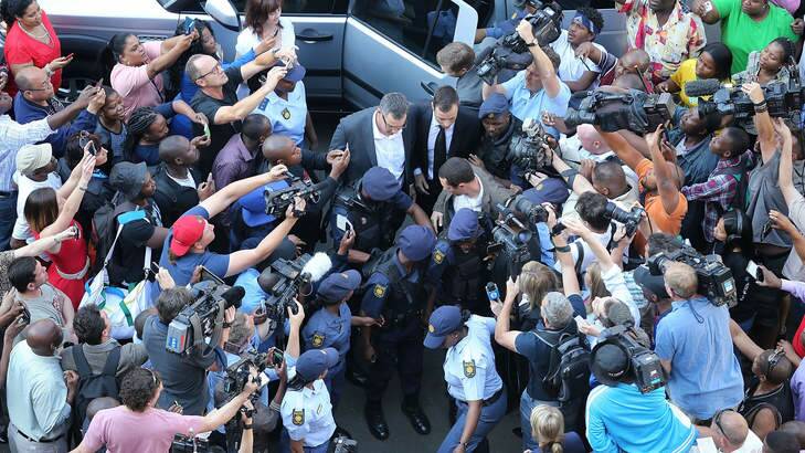 The media scrum outside court as Oscar Pistorius arrives on September 12. Photo: Christopher Furlong