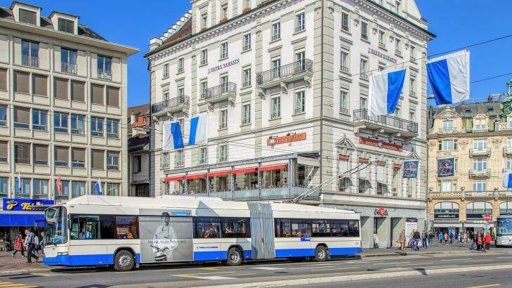 A trolley bus transports people through Schwanenplatz Square.  Photo: iStock