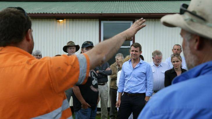 Premier Mike Baird hears from a miner opposed to the expansion of the Rio Tinto mine near Bulga. Photo: Marina Neil
