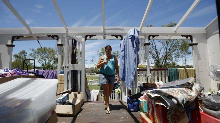 Yeppoon resident Demelza Bischoff inspects the damage to her home. Photo: Jason Reed