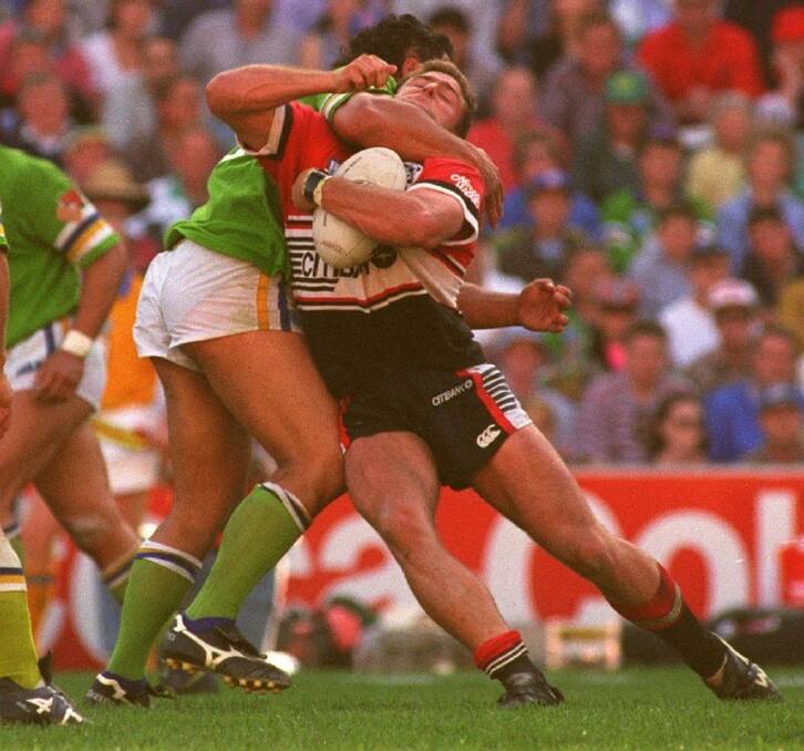 Lohn Lomax's tackle on Billy Moore in the 1994 preliminary final. Photo: Craig Golding