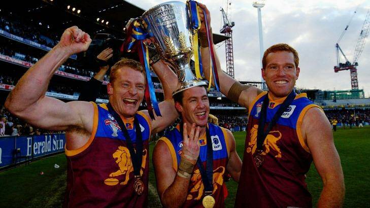 The Lions celebrate their third cup in 2003. Photo: Ray Kennedy