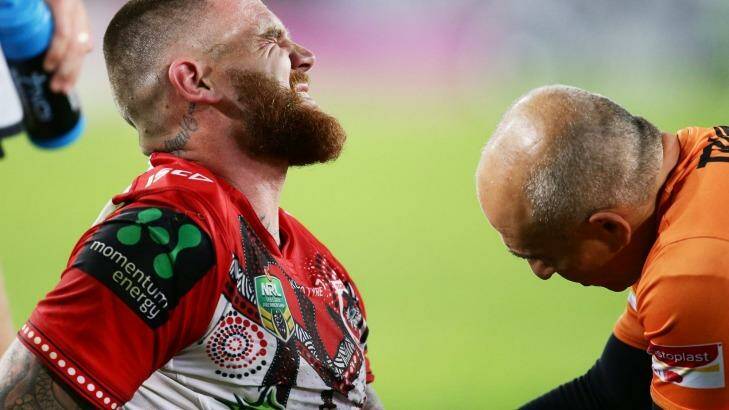 Josh Dugan of the Dragons after injuring his elbow against the Rabbitohs on Thursday night. Photo: Matt King