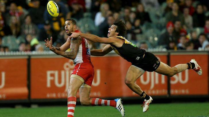 Meeting his match: Lance Franklin has his marking attempt spoiled by star Tiger defender Alex Rance. Photo: Pat Scala