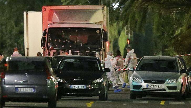 Police surround the truck that slammed into a Bastille Day crowd in NIce on Thursday. Photo: Luca Bruno