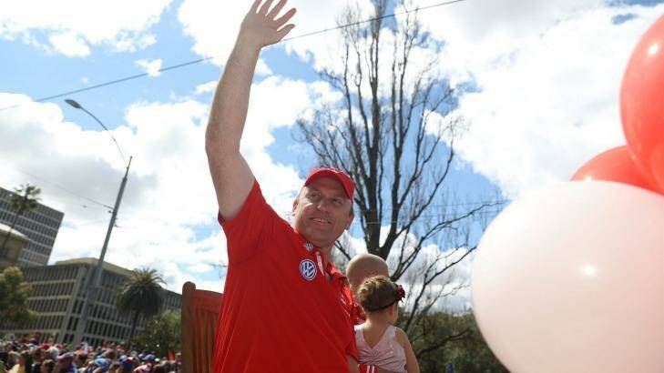 Swan coach John Longmire waves at fans. Photo: Robert Cianflone