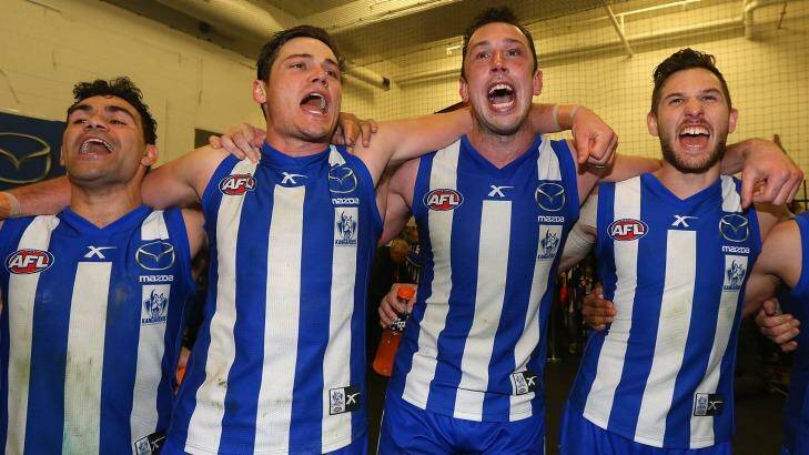 Back then: Kangaroos Lindsay Thomas, Nathan Grima, Todd Goldstein and Aaron Black sing the song after winning their semi-final against Geelong in 2014. Photo: Quinn Rooney