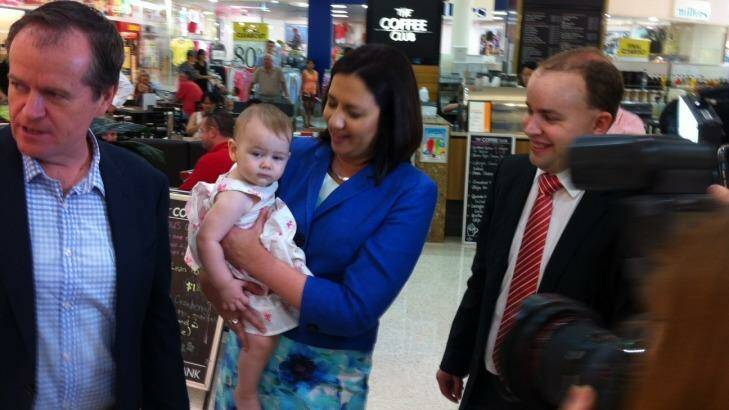 Opposition Leader Annastacia Palaszczuk, with federal counterpart Bill Shorten and Stretton candidate Duncan Pegg, delivers the first official baby cuddle of the Labor campaign to 12-month-old Larissa Soter of Sunnybank Hills. Photo: Tony Moore