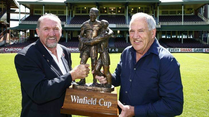 Three decades later ... Ray Price and Mick Cronin hold the 1986 premiership trophy aloft at the SCG. Photo: Steve Christo