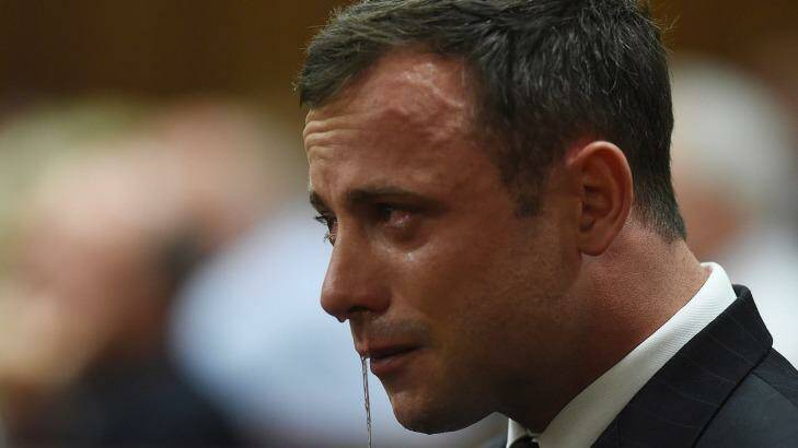 'Not guilty of murder' ... Oscar Pistorius reacts in the Pretoria High Court. Photo: Getty Images
