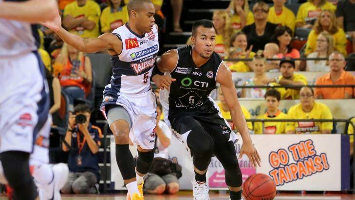 Import duel: Melbourne guard Stephen Holt holds off the advances of Cairns rival Markel Starks. Photo: Alix Sweeney/NBL