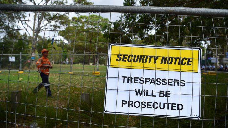 A man walks inside the fenced off area on the Euston Road side of Sydney Park where access to a public toilet is blocked. Anti-WestConnex protesters and local residents are unhappy with the blocked access to the toilet facility. St Peters, Sydney. 4th January, 2017. Photo: Kate Geraghty Photo: Kate Geraghty