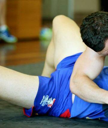 Wrestlemania: Jarrod Mullen performs a wrestling exercise at Knights training last year. Photo: Ryan Osland