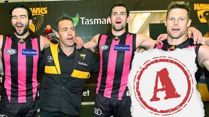 Pretty in pink: Jordan Lewis,  Alastair Clarkson, Luke Hodge and Sam Mitchell celebrate the win over Gold Coast.