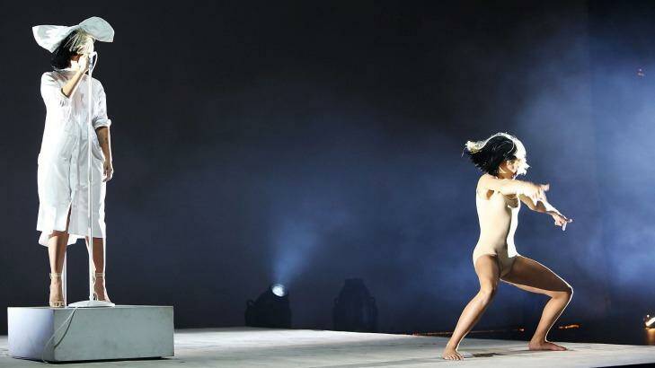 Sia looked like she didn't give a damn and carried on singing while a  dancer performed. Photo: Jason Bahr