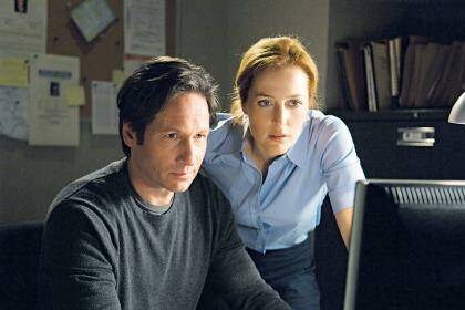 The truth will out ... David Duchovny and Gillian Anderson in the original series.