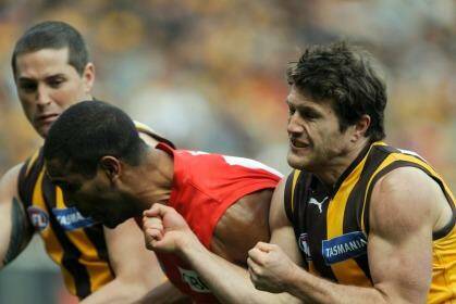 Hawthorn's Campbell Brown crunches Sydney's Michael O'Loughlin.