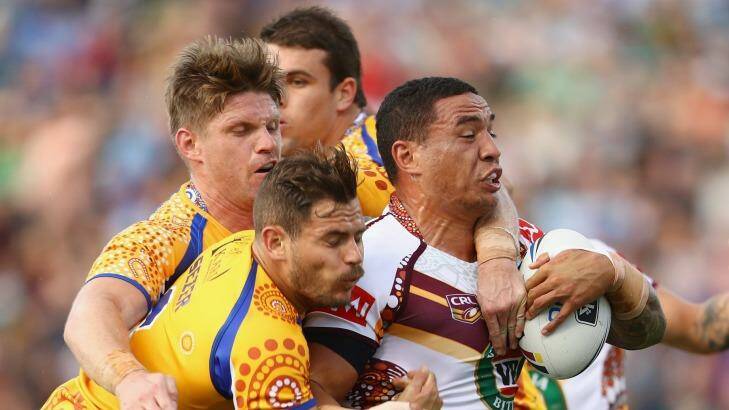 Held back: Tyson Frizell of Country is tackled by Chris Lawrence and Aidan Sezer. Photo: Mark Kolbe