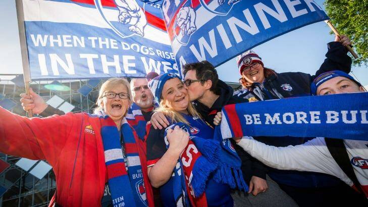 Bulldogs supporters Marilyn, Kym, Nicole, Chris, Danielle and Jack arrive at Whitten Oval after travelling to Sydney by bus to watch the preliminary final. Photo: Chris Hopkins