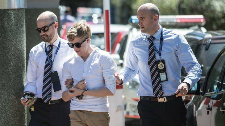 A member of Tiahleigh Palmer's foster family arrives at Logan police station on Tuesday.  Photo: Glenn Hunt