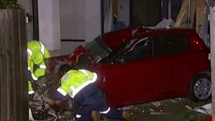 There were no serious injuries when a car was driven through a house in Brisbane. Photo: Nine News