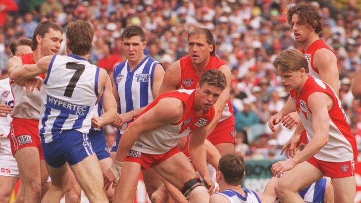 The Swans and Kangaroos battle out the 1996 grand final. Photo: Dallas Kilponen