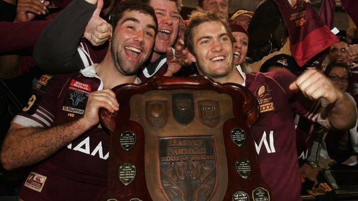 Cameron Smith and Dallas Johnson celebrate Queensland's 2006 State of Origin triumph. Photo: Adam Pretty