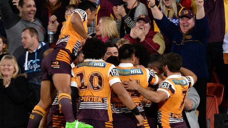 Roosters roasted: The Broncos celebrate during their win over the Roosters. Photo: Bradley Kanaris