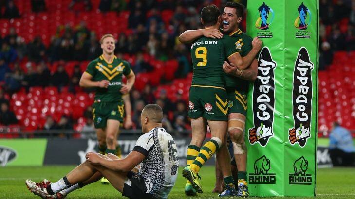 League at Wembley: Andew Fifita and Cameron Smith celebrate a try for Australia against Fiji during the Rugby League World Cup semi-final at Wembley Stadium in 2013. Photo: Michael Steele