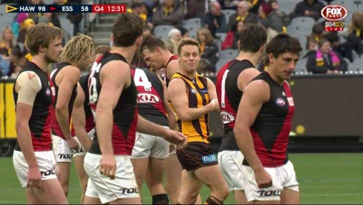Sam Mitchell gestures towards Essendon players, pretending to inject himself in the arm. Photo: Fox Footy