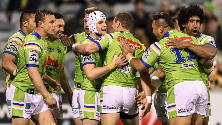 Red-hot Raiders: Canberra celebrate a try during their round 23 win over the Melbourne Storm at GIO Stadium on Monday. Photo: Getty Images 