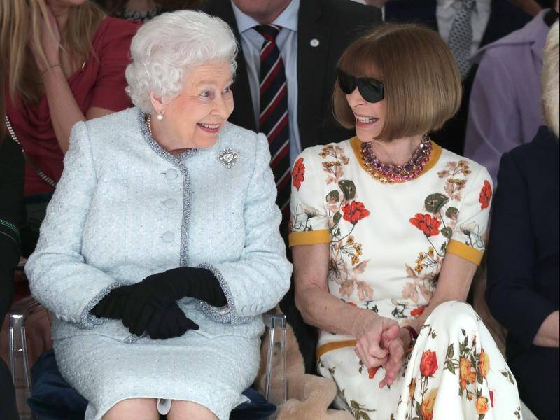 Anna Wintour has been criticised for not removing her sunglasses as she chatted to the Queen.