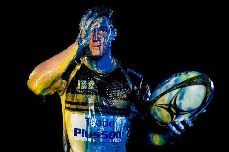 Brumbies player Kyle Godwin taking part in a paint throwing photoshoot for the season Guide. Photo Jay Cronan. Contact Chris Dutton before use. 0437224510 Photo: Jay Cronan
